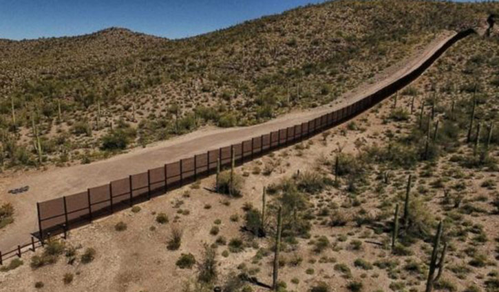 Trump backs down on border wall funding