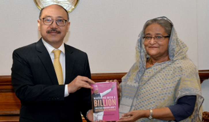 Shringla presents copy of 'Marching with a Billion' to PM