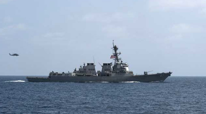 US Navy ship fires warning shot at Iranian boats