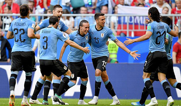 Uruguay beat Russia 3-0, win Group A