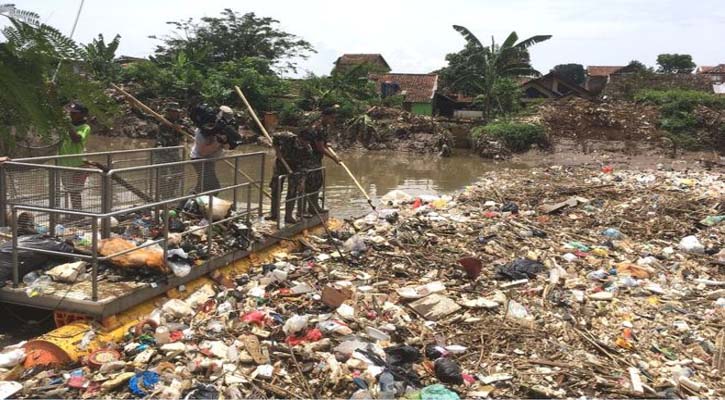 Giant plastic berg blocks Indonesian river