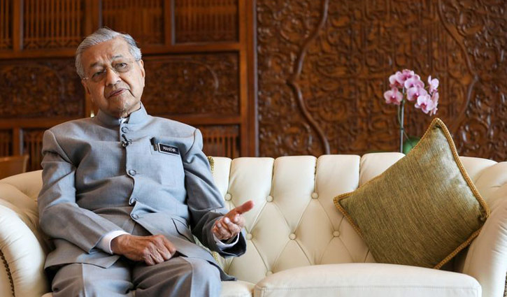 Mahathir to step down, but not before November next year