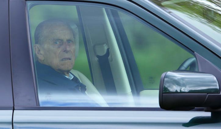 Prince Philip unhurt in car crash while driving