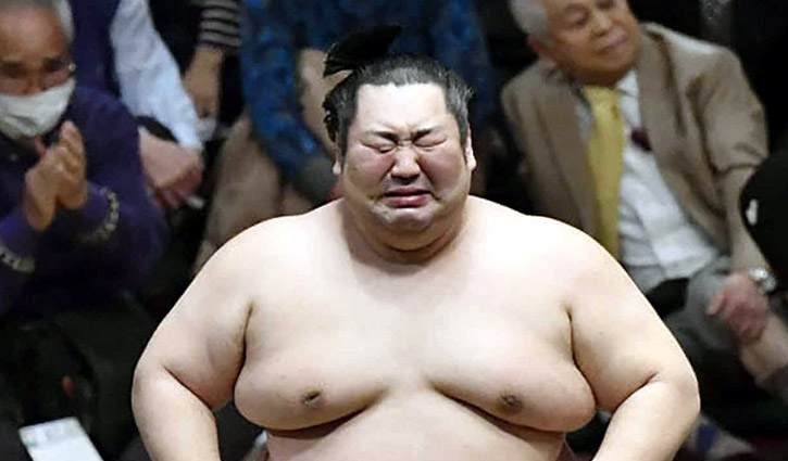 Sumo wrestler weeps as he defies odds to win tournament