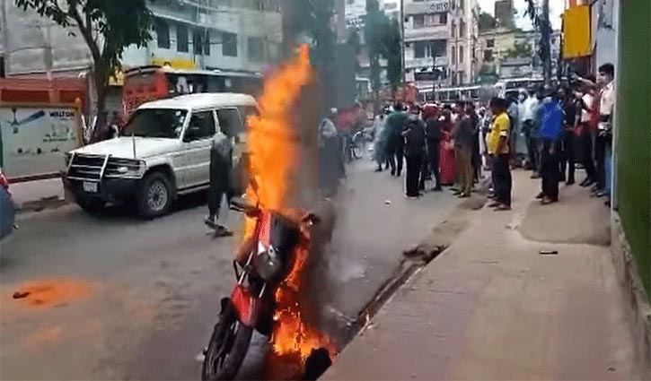 Youth sets his motorcycle on fire